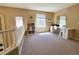 Bright loft space with carpet and a built-in bookcase perfect for use as an office at 5394 S Gray St, Littleton, CO 80123
