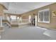 Large loft space with neutral carpet and views of the living room below at 5394 S Gray St, Littleton, CO 80123