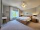 Spacious main bedroom with carpet, neutral walls, a large window, and ensuite bathroom at 5394 S Gray St, Littleton, CO 80123