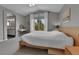 Comfortable main bedroom with carpet, neutral walls, a large window, and ensuite bathroom at 5394 S Gray St, Littleton, CO 80123
