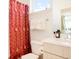 Bright bathroom featuring modern fixtures and a decorative shower curtain at 8711 E Hampden Ave # 26, Denver, CO 80231