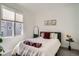 Comfortable bedroom with natural light, modern decor, and a cozy bed at 8711 E Hampden Ave # 26, Denver, CO 80231