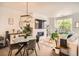 Cozy living room featuring a fireplace, a mounted tv, and modern decor at 8711 E Hampden Ave # 26, Denver, CO 80231