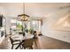 Living area featuring a dining table, large windows, and stylish decor at 8711 E Hampden Ave # 26, Denver, CO 80231