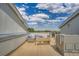 Rooftop deck with wicker furniture and views offers great space for outdoor living at 8711 E Hampden Ave # 26, Denver, CO 80231