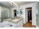 Bathroom with granite countertops, vanity with sink, and large mirror, complemented by a large closet at 12183 W Cross Dr # 202, Littleton, CO 80127
