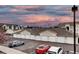 Row of garages in a residential area under a vibrant sky at 12183 W Cross Dr # 202, Littleton, CO 80127