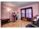 Cozy living room with wooden floors, warm lighting, plants, and comfortable furniture, perfect for relaxation at 12183 W Cross Dr # 202, Littleton, CO 80127