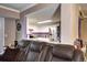 Comfortable living room with a view into the modern kitchen, with granite countertops and stainless steel appliances at 12183 W Cross Dr # 202, Littleton, CO 80127