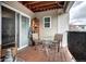 Cozy patio with wood flooring, chairs, a table, and decorative lighting at 12183 W Cross Dr # 202, Littleton, CO 80127