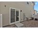 Cozy backyard with sliding door access, low maintenance gravel, and seating area at 18233 E 51St Ave, Denver, CO 80249