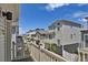 Serene view from the balcony, overlooking neighboring townhomes and a clear blue sky at 18233 E 51St Ave, Denver, CO 80249