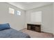 Simple bedroom design featuring two side windows, a mounted dresser, and carpet at 18233 E 51St Ave, Denver, CO 80249