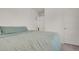 Bedroom featuring a door, carpet, and neutral walls at 18233 E 51St Ave, Denver, CO 80249