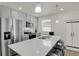 Modern kitchen featuring quartz countertops, stainless steel appliances, and ample counter space at 18233 E 51St Ave, Denver, CO 80249