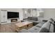 Inviting living area with fireplace, plush sofa, and a view of the outdoor balcony at 18233 E 51St Ave, Denver, CO 80249