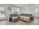 Comfortable living room with plush sectional sofa, stylish decor, and a large window at 18233 E 51St Ave, Denver, CO 80249