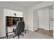 Bright home office featuring a window, desk with shelving, and comfortable chair at 18233 E 51St Ave, Denver, CO 80249