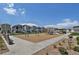 Community playground with swings, climbing structures, and seating for residents at 18233 E 51St Ave, Denver, CO 80249