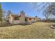 Backyard with a brick chimney, and a well-maintained lawn, perfect for outdoor relaxation and activities at 8195 Field Ct, Arvada, CO 80005