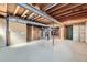 Spacious unfinished basement with exposed ceiling and concrete floors, ready for customization and storage at 8195 Field Ct, Arvada, CO 80005