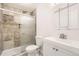 Updated bathroom with tiled shower and modern vanity at 8195 Field Ct, Arvada, CO 80005