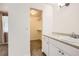 Bathroom featuring a sink and vanity adjacent to a walk-in closet at 8195 Field Ct, Arvada, CO 80005