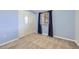 Cozy bedroom with blue walls, a window with blinds, and a closet at 8195 Field Ct, Arvada, CO 80005