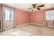 Comfortable main bedroom with large windows and a ceiling fan at 8195 Field Ct, Arvada, CO 80005