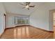 Open bedroom area with wood floors and a window seat at 6556 S Versailles Ct, Aurora, CO 80016