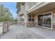 Spacious deck offering stone accents, railing, siding, and sliding glass door for indoor-outdoor living at 6556 S Versailles Ct, Aurora, CO 80016