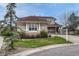 Elegant home with a well-manicured lawn, stylish pillars, and a neutral color palette at 6556 S Versailles Ct, Aurora, CO 80016