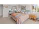 Inviting bedroom features a mirrored closet, and a side table, creating a peaceful and comfortable space to unwind at 606 Sugarloaf Mountain Rd, Boulder, CO 80302