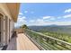 Expansive deck with stunning panoramic views of the mountains and lush greenery, perfect for relaxation at 606 Sugarloaf Mountain Rd, Boulder, CO 80302