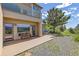 Backyard patio with bench seating, hammock, and outdoor dining with scenic views of the surrounding landscape at 606 Sugarloaf Mountain Rd, Boulder, CO 80302