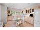 Cozy kitchen features tile countertops, a glass dining table, tile floors, and ample cabinet space at 606 Sugarloaf Mountain Rd, Boulder, CO 80302