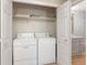 Convenient laundry closet with side-by-side washer and dryer units, offering practicality and efficiency for household chores at 606 Sugarloaf Mountain Rd, Boulder, CO 80302