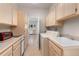 Functional laundry room with ample cabinetry and counter space at 606 Sugarloaf Mountain Rd, Boulder, CO 80302