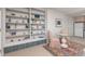 Cozy living area features built-in shelving, a round table, and a colorful rug, perfect for relaxing and entertaining guests at 606 Sugarloaf Mountain Rd, Boulder, CO 80302