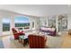 Inviting living room with large arched window offering panoramic mountain views at 606 Sugarloaf Mountain Rd, Boulder, CO 80302