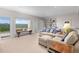 Inviting living room with beautiful mountain views, built-in bookshelves, and comfortable seating at 606 Sugarloaf Mountain Rd, Boulder, CO 80302