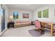 Bright office space featuring large windows, a comfortable sofa, and a functional desk area at 606 Sugarloaf Mountain Rd, Boulder, CO 80302