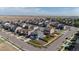 Aerial view of a residential neighborhood showing well-maintained homes, green spaces, and a playground in a Gathering-friendly environment at 902 William Way, Brighton, CO 80603