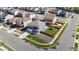 Aerial view of a home with fenced backyard featuring a play structure, nice landscaping, and situated in a quiet neighborhood at 902 William Way, Brighton, CO 80603