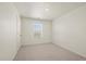 Simple bedroom design with a window allowing natural light, plus neutral carpet at 902 William Way, Brighton, CO 80603