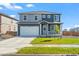 Beautiful two-story home featuring a two-car garage and manicured front lawn at 902 William Way, Brighton, CO 80603