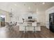 Modern kitchen with granite countertops, stainless steel appliances, and bar seating at 902 William Way, Brighton, CO 80603