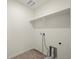 View of the laundry room with a large shelf and hookups for a washer and dryer at 902 William Way, Brighton, CO 80603