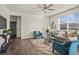 Cozy living room with a plush rug, stylish furniture, and plenty of natural light at 902 William Way, Brighton, CO 80603