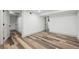 Spacious basement area with hardwood floors and access to multiple rooms through white doors at 4022 E 17Th Avenue Pkwy, Denver, CO 80220